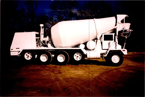 Old film print from the Spies archive showing a white concrete mixer truck at night