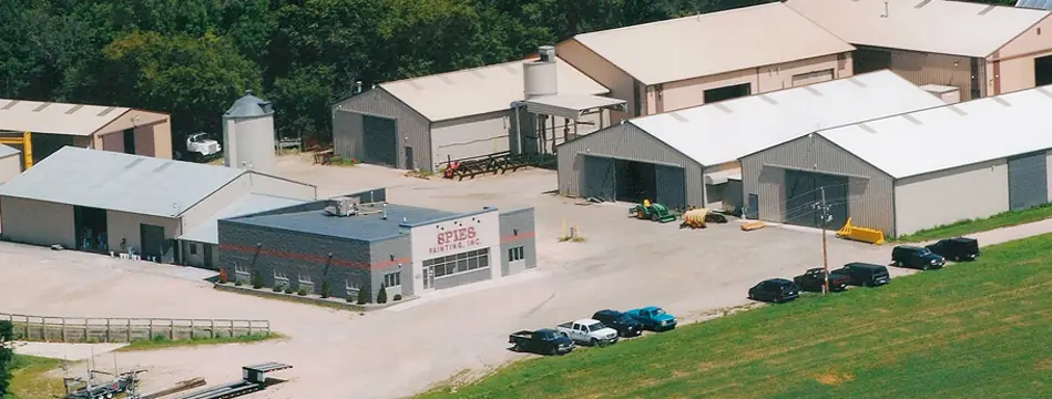 Aerial view of the Spies Painting campus on US Highway 151: office and steel shop buildings