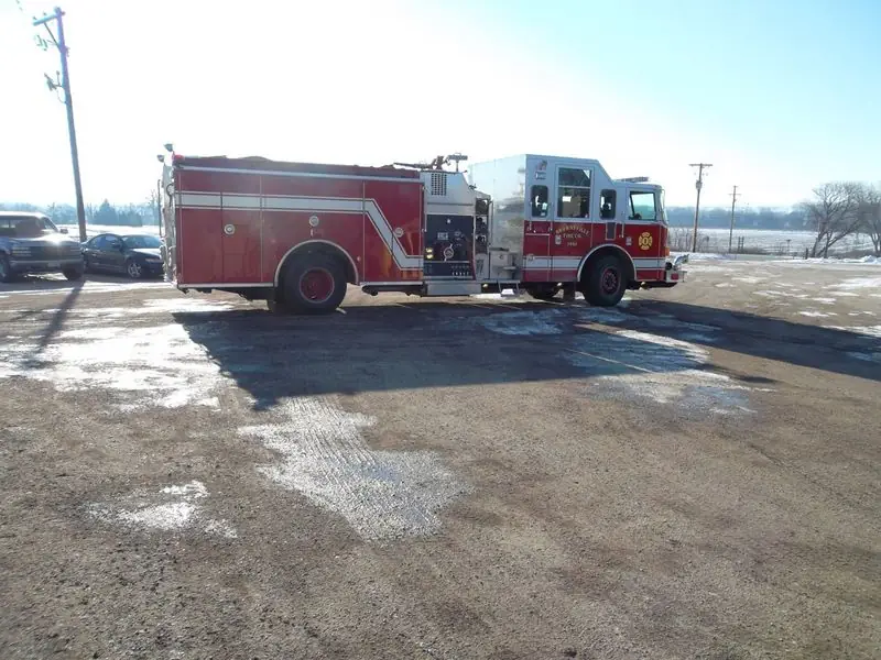 Red fire engine painted by Spies Painting, parked in the lot