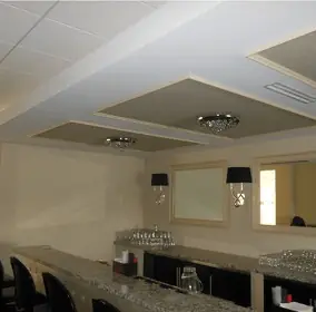 Finished bar and lounge with a coffered ceiling